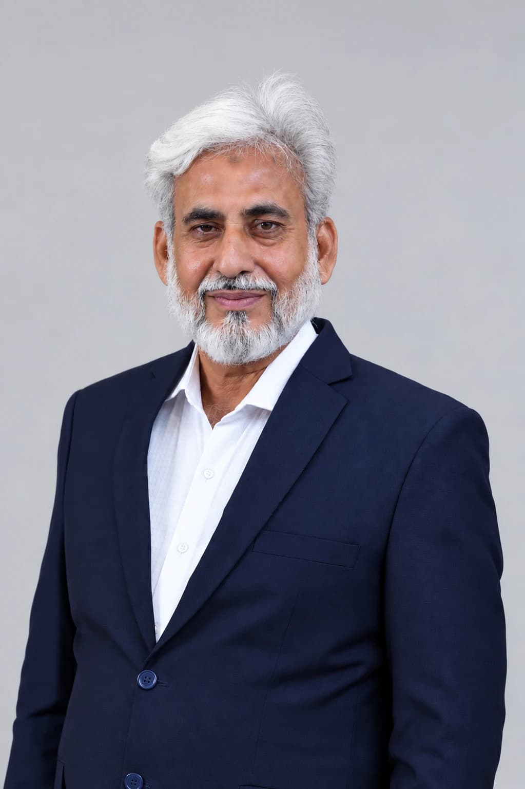 Portrait of a senior consultant at M.S. Consultant in a navy suit