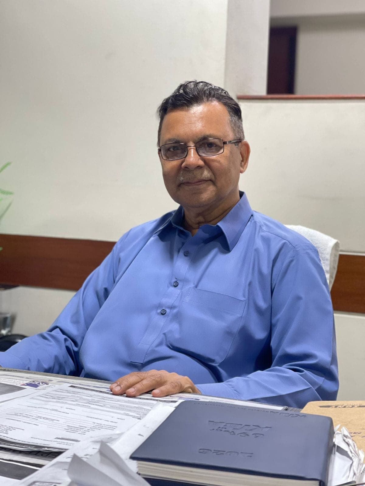 Ali Nawaz Channa, Income Tax Compliance & Correspondence Officer, at his desk