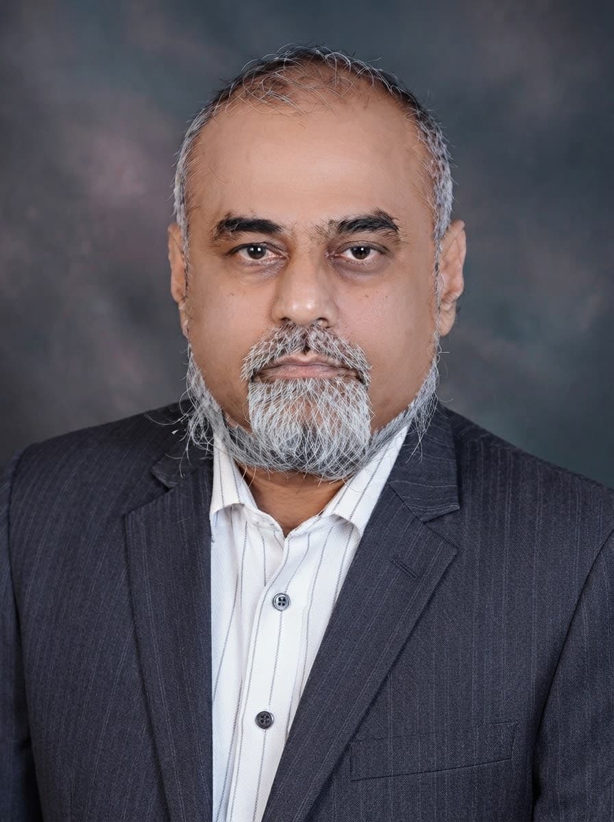 Hatim Rangwala FCA, Chief Executive, in a pinstriped suit